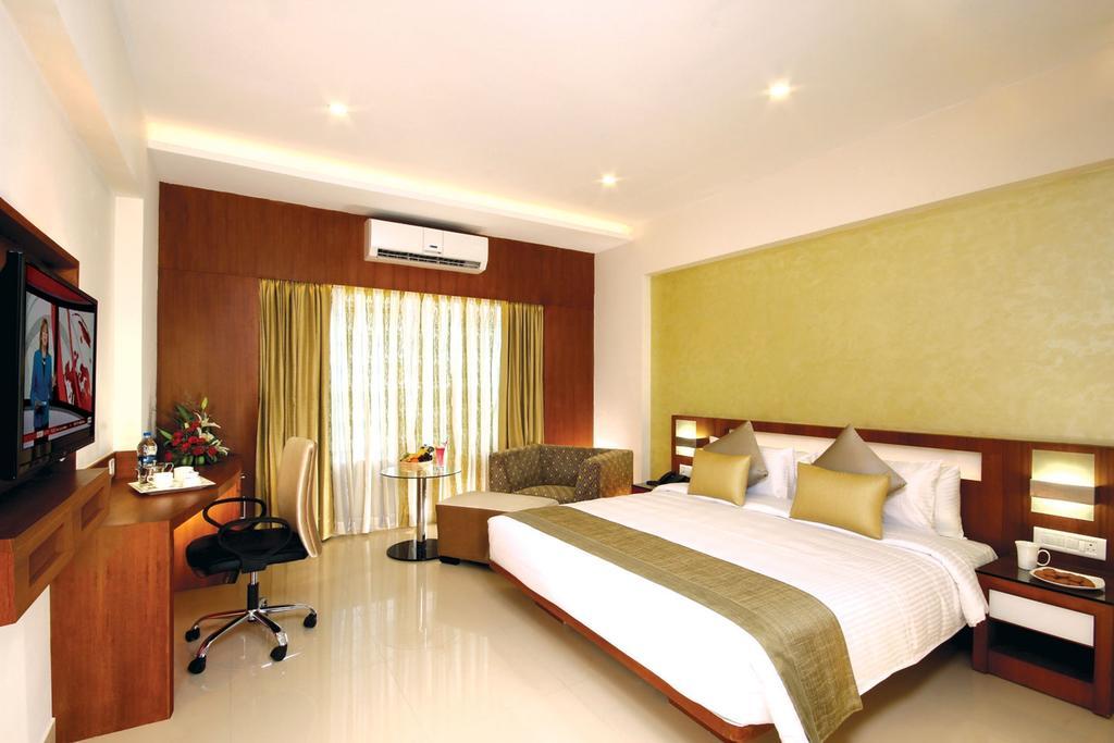 Hotel Chrysoberyl Kottayam Pokoj fotografie